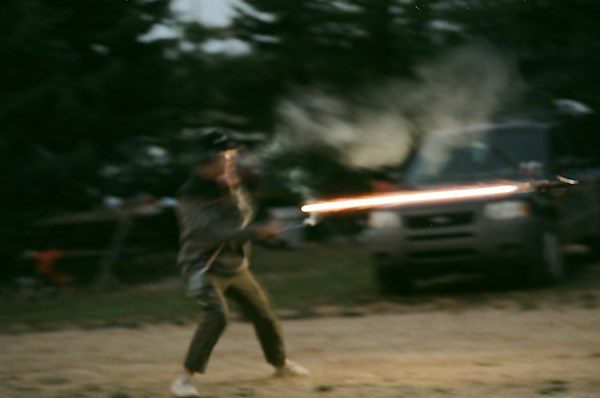 A firework fired sideways across a campsite