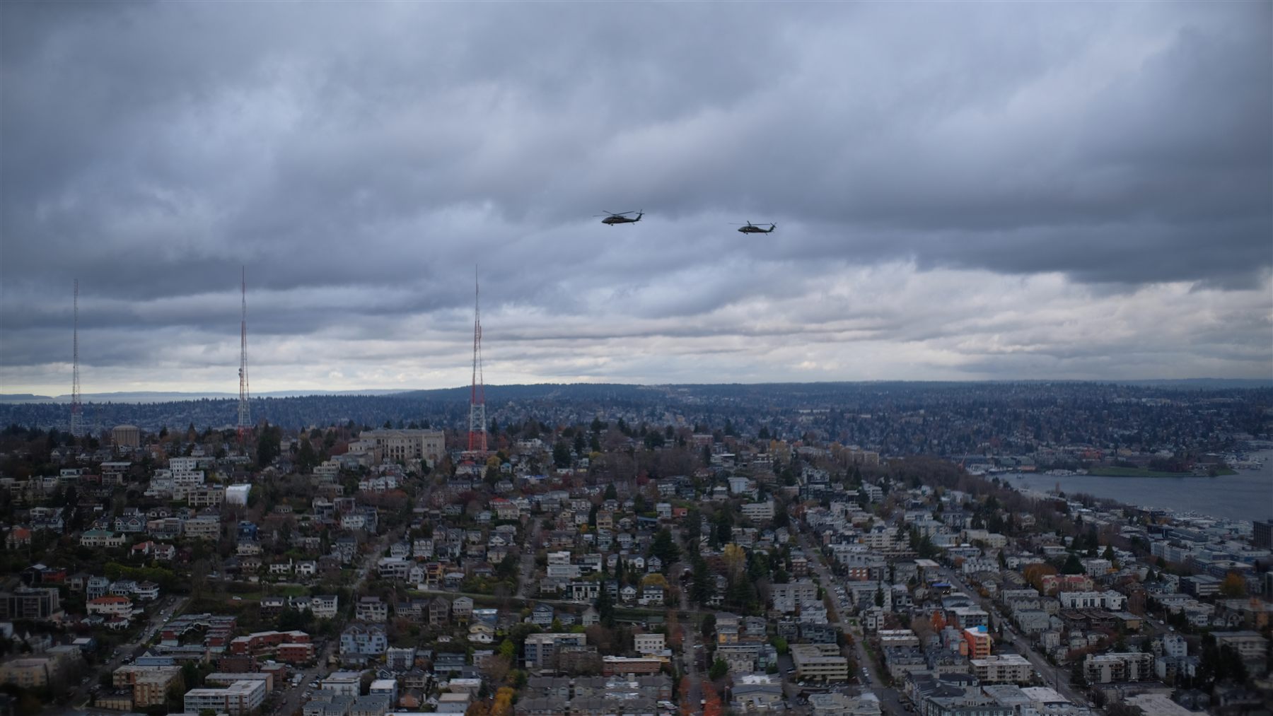 Seattle's neighbourhoods seen from above with helicopters overhead
