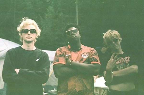 Three friends posing in sunglasses