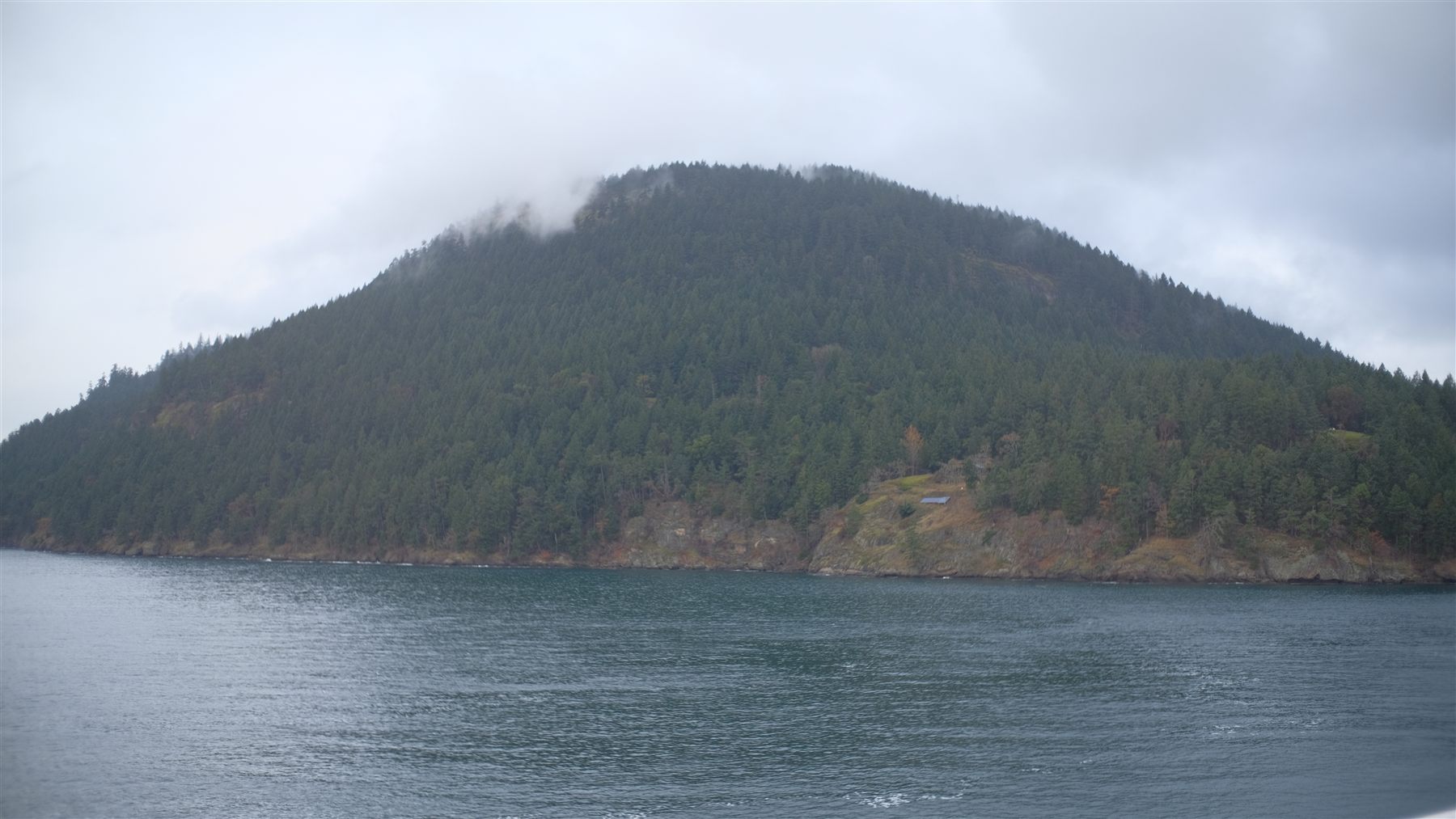A misty island across the water